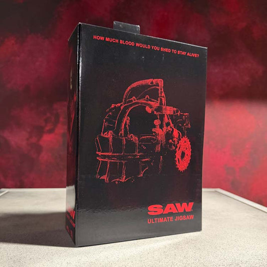 SAW – Ultimate Jigsaw Killer (Red Robe) - 7” Scale Figure NECA - front view - Apparel | Terror 29