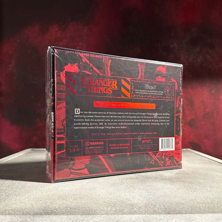 Stranger Things puzzle box packaging with red and black design on a dark background
