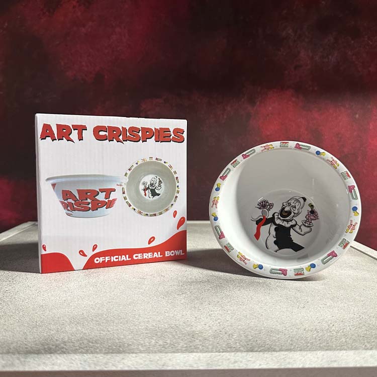 Terrifier Art Crispies official cereal bowl with packaging on a textured surface and red background