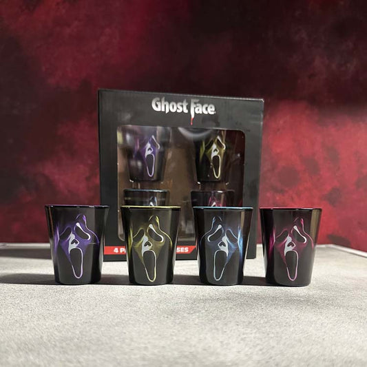 Set of black shot glasses with colorful designs in front of a 'Ghostface' branded box.