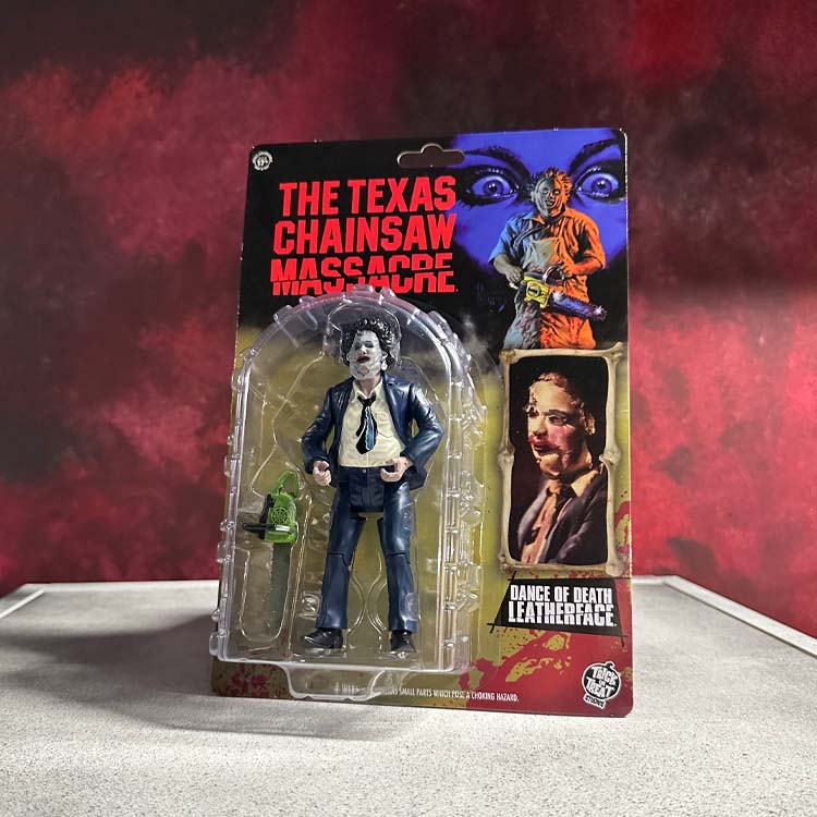Action figure of Leatherface with the pretty woman mask in packaging with 'The Texas Chainsaw Massacre' branding